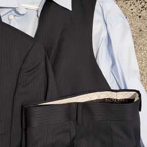 Navy pinstrip 4-peice suit excellent condition.